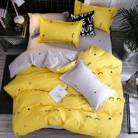 Яркий желтый комплект постельного белья со звездочками фото